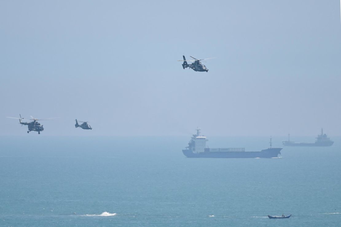 Chinese military helicopters fly past Pingtan island, one of mainland China's closest point from Taiwan on August 4, 2022.