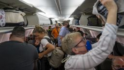 Travelers wait to offload their flight at Portland International Airport on July 11, 2022 in Portland, Oregon. Staffing shortages, the COVID-19 pandemic and other issues have led to historic levels of disruptions in U.S. air travel. 