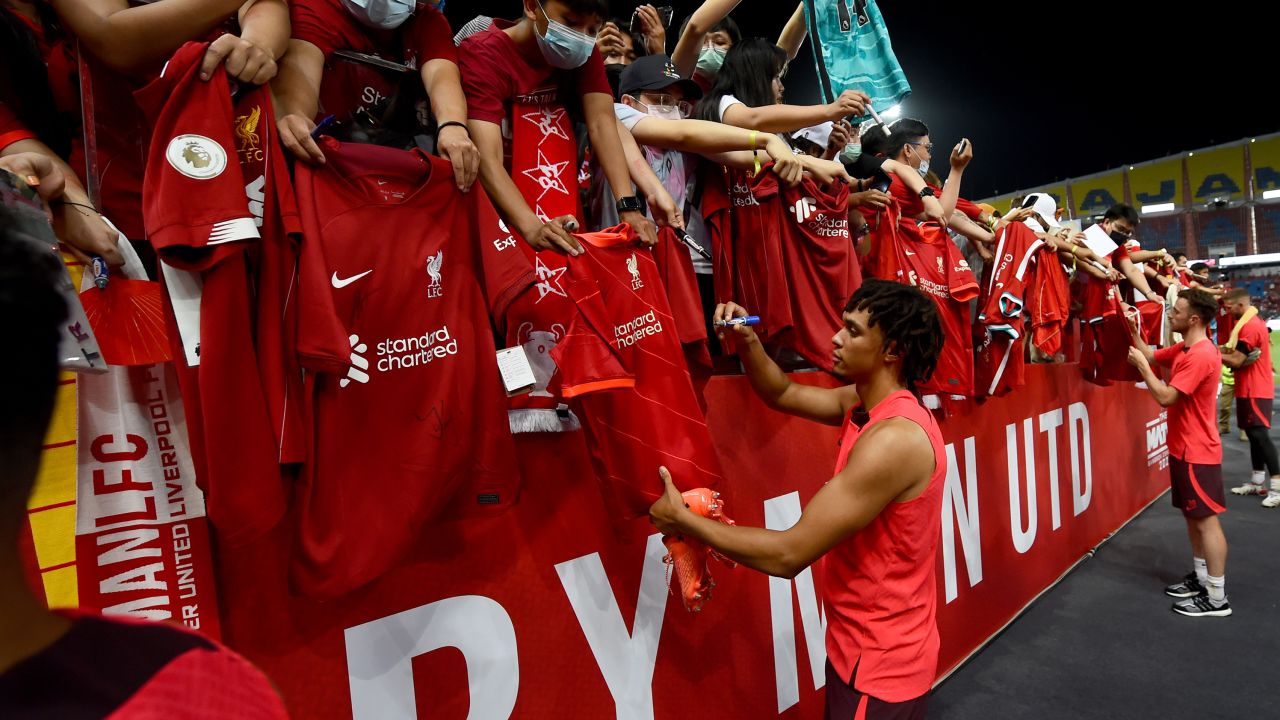 Alexander-Arnold signing autographs at the end of the open training session on July 11 in Bangkok, Thailand.