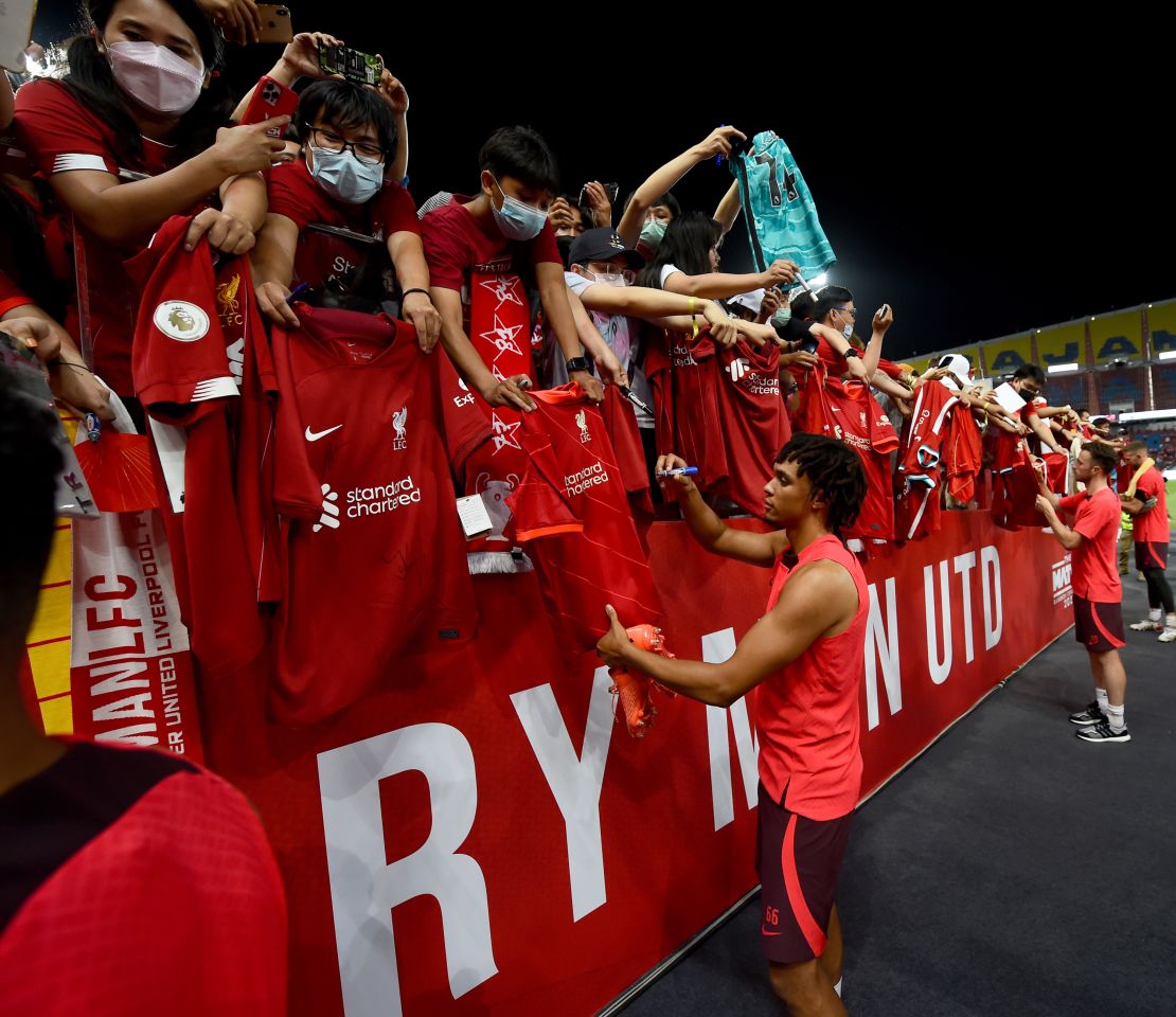 Alexander-Arnold signing autographs at the end of the open training session on July 11 in Bangkok, Thailand. 