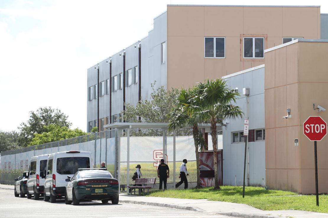 Court deputies exit vans that transported jurors to Marjory Stoneman Douglas High School in Parkland, Florida, on Thursday to view the 1200 building, the crime scene where the 2018 shooting took place.