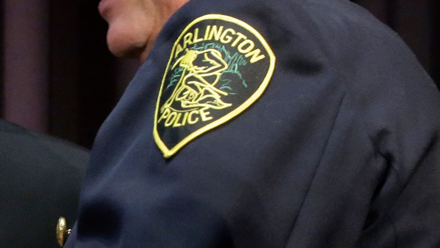 An Arlington Police patch is seen on an officer's uniform. 