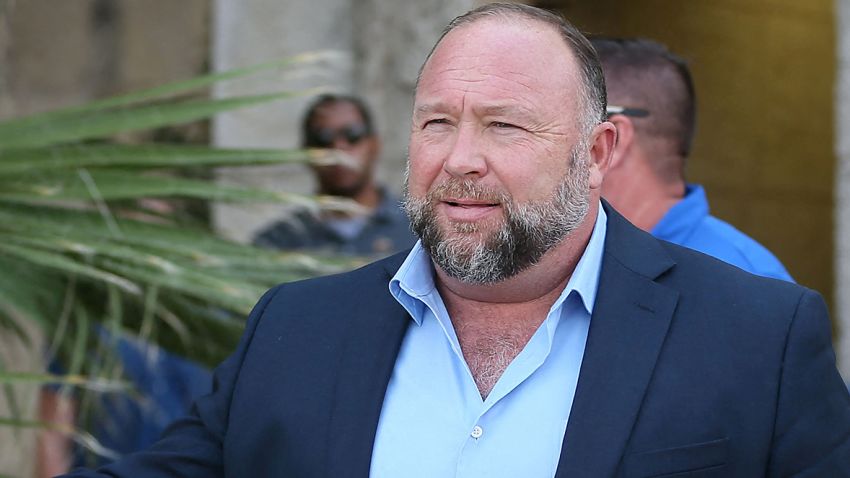 Alex Jones steps outside of the Travis County Courthouse, to do interviews with media after he was questioned under oath about text messages and emails by lawyer Mark Bankston, in Austin, Texas, U.S. August 3, 2022. Briana Sanchez/Pool via REUTERS
