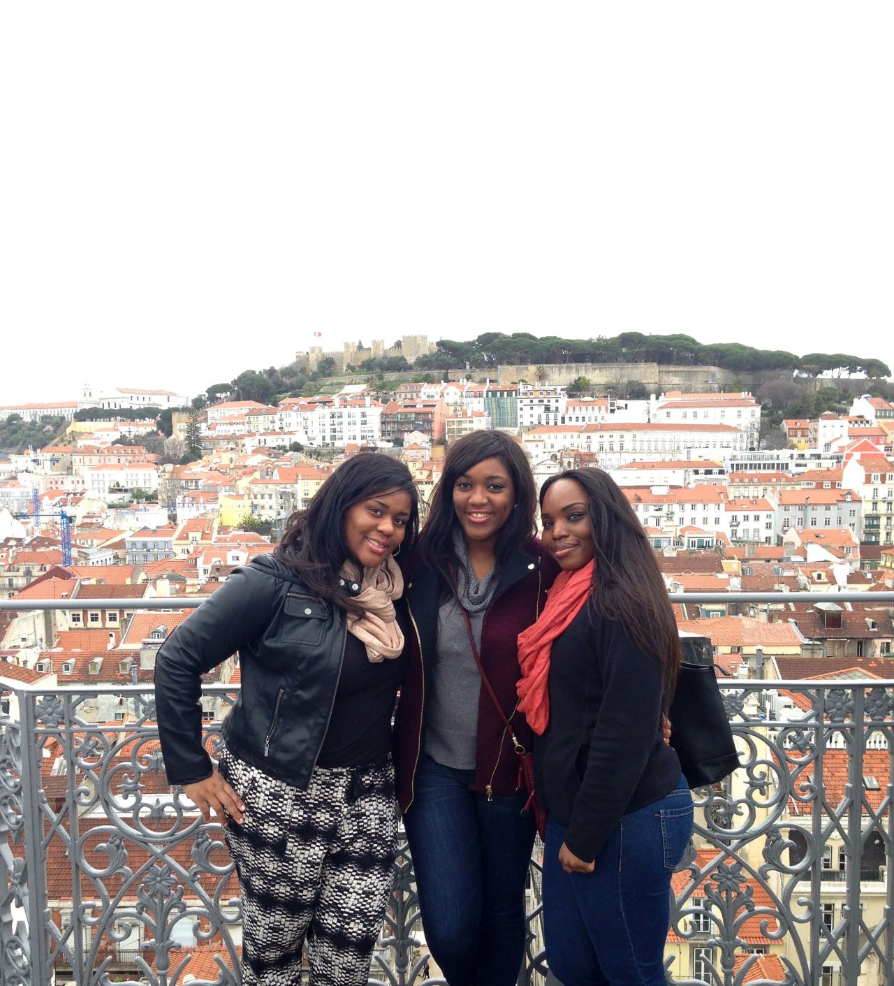 Esther and Alicia Tambe in Lisbon, Portugal, with their sister Maria (far right), who died from breast cancer in 2019.