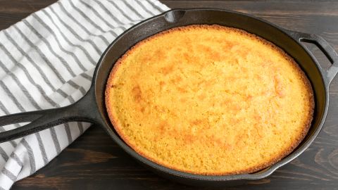 Savor the crispy golden crust of cornbread after cooking it in a cast iron skillet.
