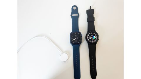 (left to right): The Apple Watch wireless charger, the Apple Watch and the Samsung Galaxy Watch we used during testing. For both smartwatches, you can choose all kinds of timekeeping faces and load numerous apps besides payment apps.