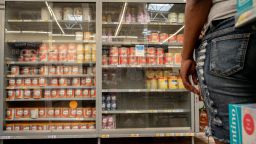 A customer stands waiting for assistance to receive baby formula in a Walmart Supercenter on July 08, 2022 in Houston, Texas. Consumer goods continue seeing shortages as the country grapples with ongoing supply chain issues stemming from the pandemic.  