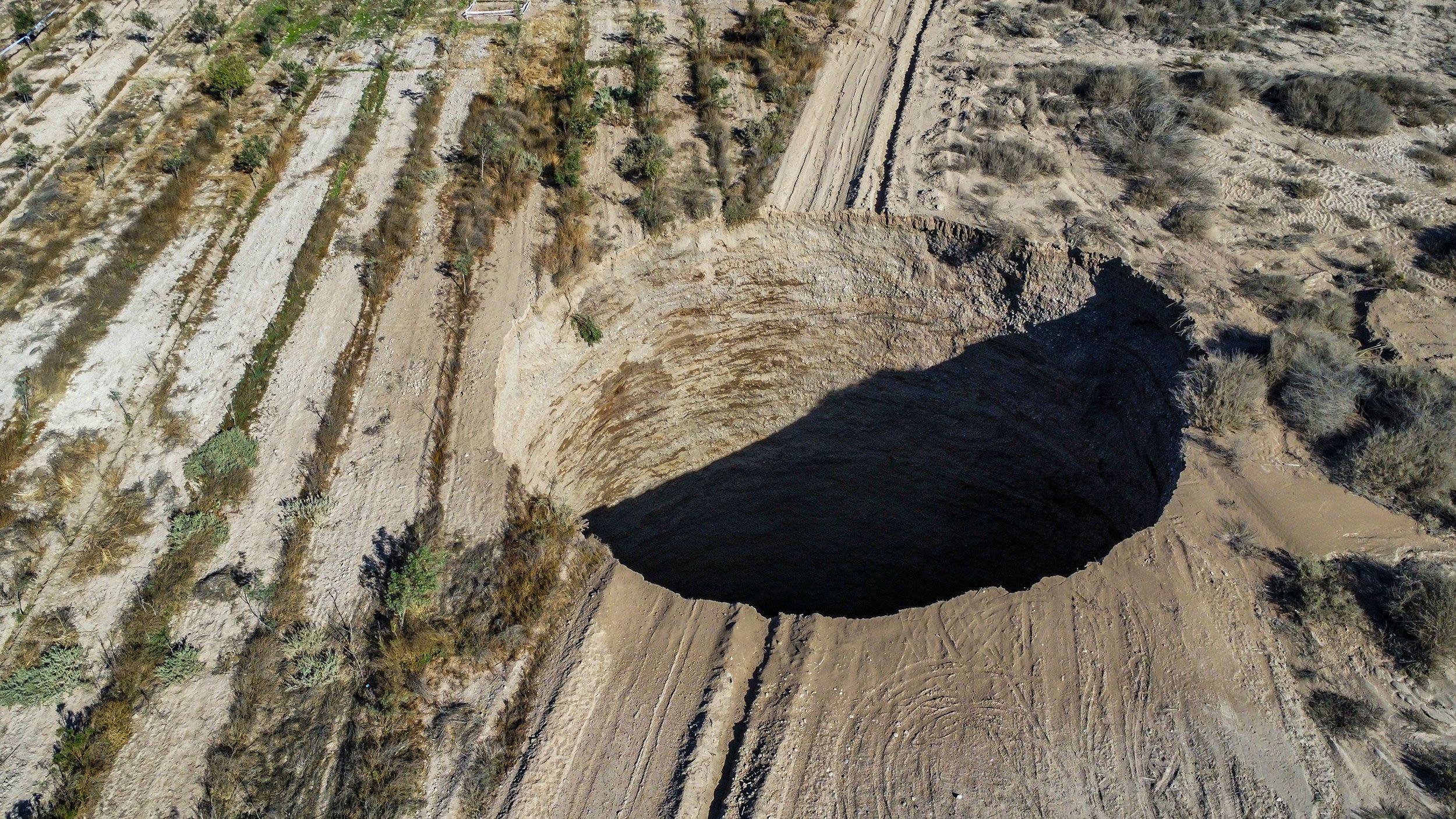 Aerial photo of a large sinkhole near a mine in Tierra Amarilla, Chile