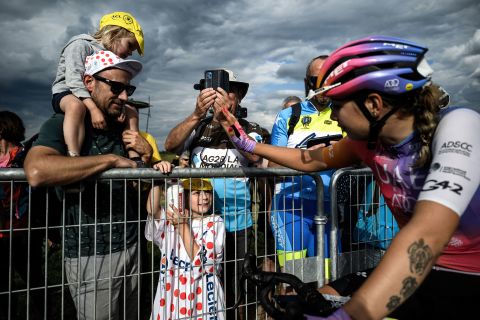 A young fan watches cyclist Maaike Boogaard after the seventh stage of the Women's Tour de France on Saturday, July 30.