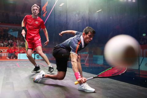 India's Saurav Ghosal plays a shot against England's James Willstrop during a squash match at the Commonwealth Games on Wednesday, August 3. Ghosal defeated Willstrop to win the bronze medal.