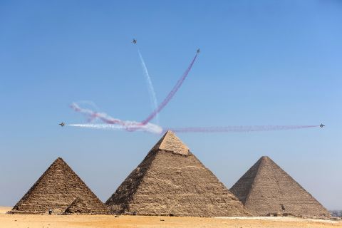 A South Korean aerobatics team performs over Egyptian pyramids during an air show on Wednesday, August 3.