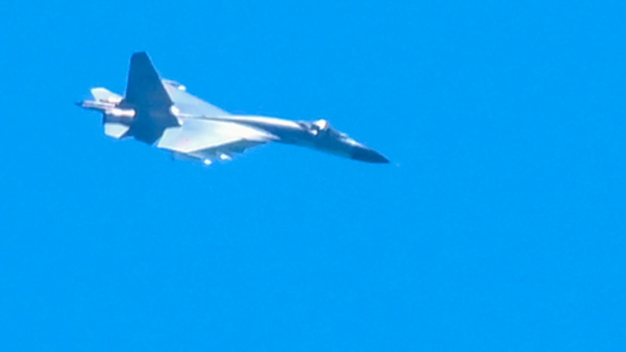 A Chinese military jet flies over Pingtan island, one of mainland China's closest point from Taiwan, in Fujian province on August 5, 2022.