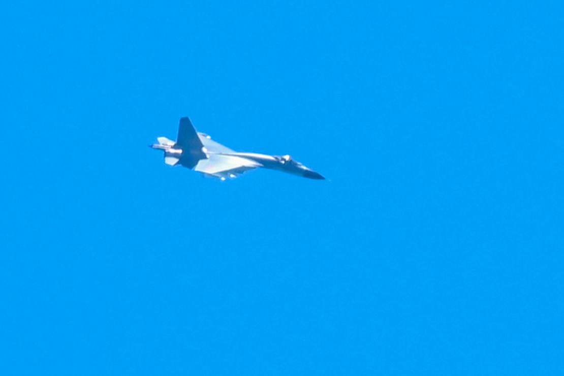 A Chinese military jet flies over Pingtan island, one of mainland China's closest point from Taiwan, in Fujian province on August 5, 2022.