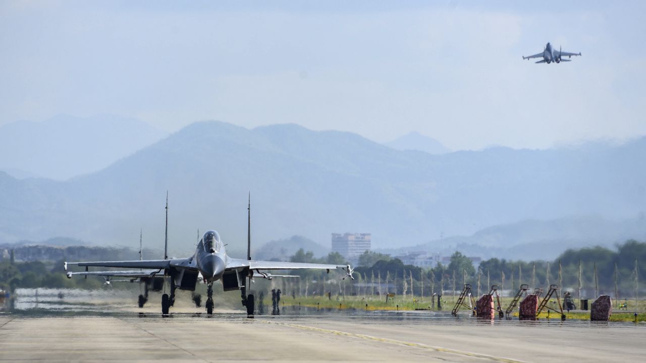 Chinese air force and naval aircraft fly at an unspecified location in China on August 4.