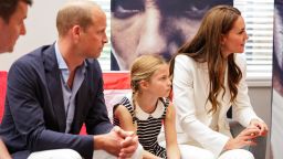 BIRMINGHAM, ENGLAND - AUGUST 02: Prince William, Duke of Cambridge, Princess Charlotte of Cambridge and Catherine, Duchess of Cambridge speak with athletes during a visit to SportsAid House at the 2022 Commonwealth Games on August 02, 2022 in Birmingham, England. The Duchess became the Patron of SportsAid in 2013, Team England Futures programme is a partnership between SportsAid, Sport England and Commonwealth Games England which will see around 1,000 talented young athletes and aspiring support staff given the opportunity to attend the Games and take a first-hand look behind-the-scenes. (Photo by Chris Jackson - Pool/Getty Images)