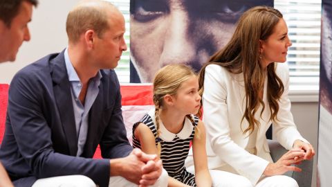 Prince William, Catherine and Charlotte speak speak with athletes during a visit to SportsAid House at the 2022 Commonwealth Games on Tuesday. 