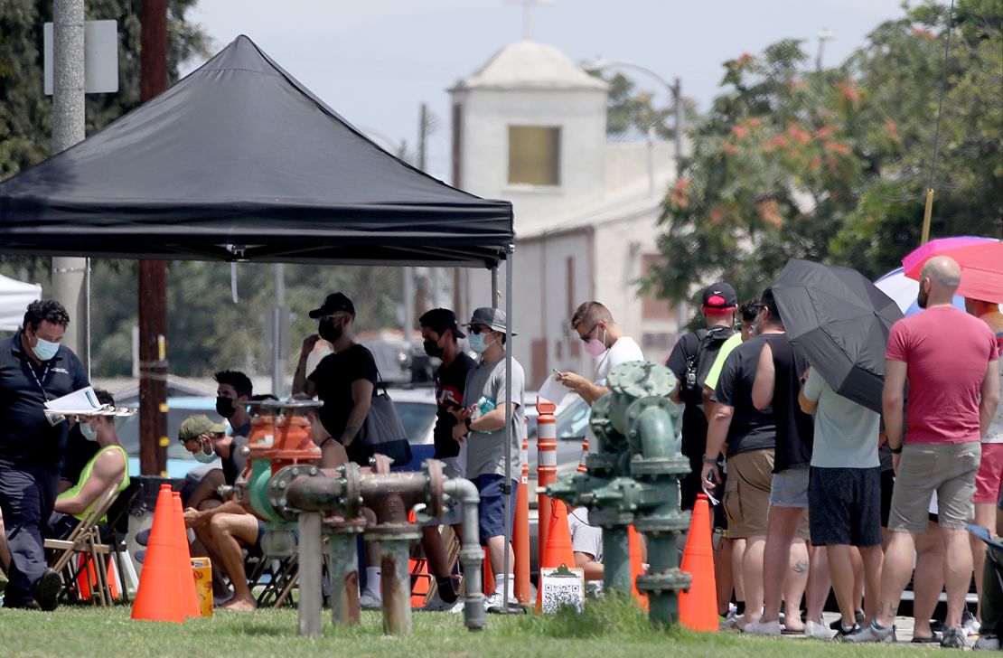 People line up get vaccinated against the monkeypox virus last month at the Ted Watkins Memorial Park in Los Angeles. 