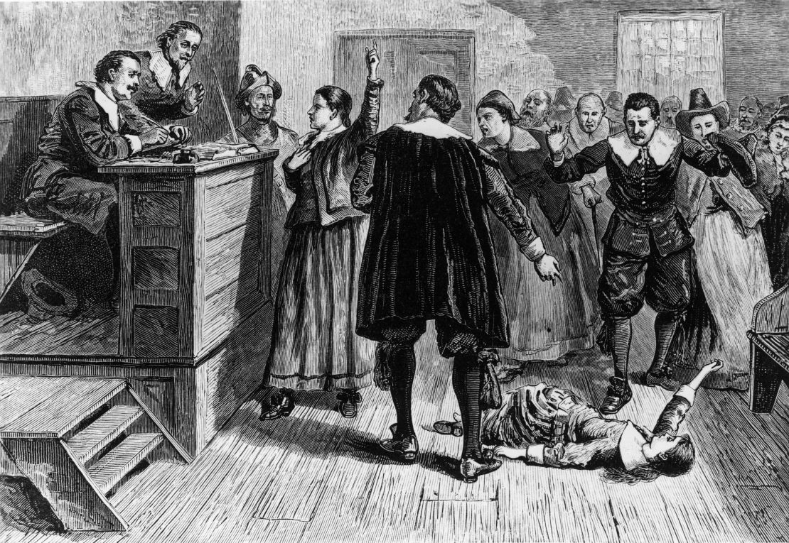 In this illustration, a young woman accused of witchcraft in Salem, Massachusetts, tries to defend herself in front of Puritan ministers.