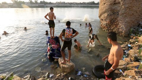 People cool off at the Tigris River during hot weather in Baghdad, Iraq on August 4.