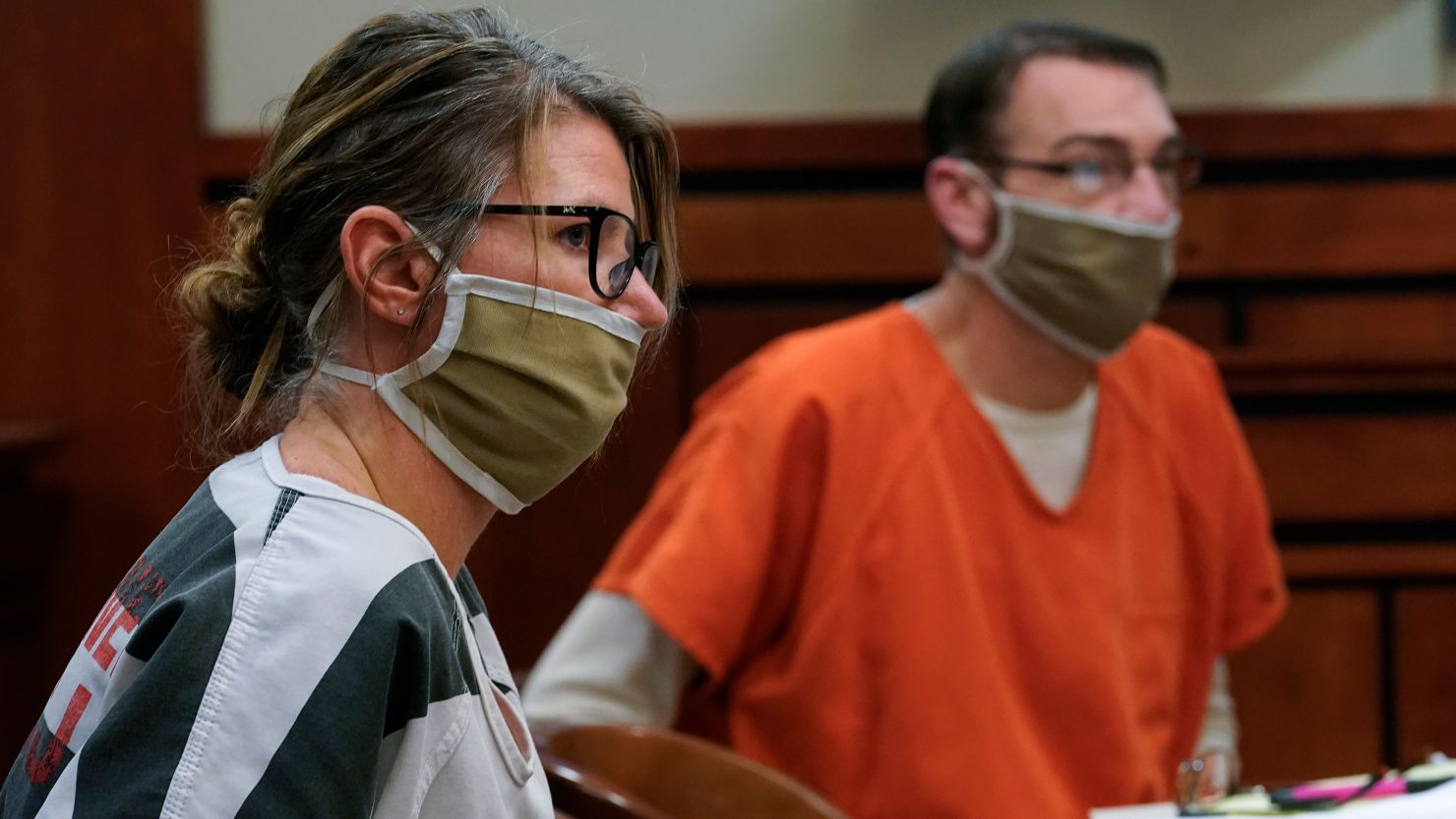 Jennifer and James Crumbley, the parents of a teenager accused of killing four students in a Michigan school shooting, seen here in court in February 2022, are said by prosecutors to have spent heavily on alcohol while also habitually arguing within earshot of son Ethan.
