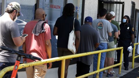 People wait in line at a DC Health location administering the monkeypox vaccine on August 5, 2022, in Washington, DC.