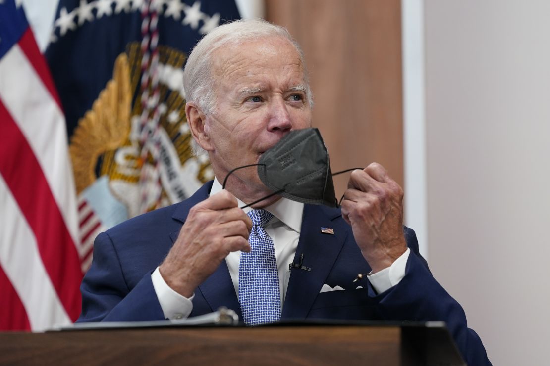 President Joe Biden removes his face mask as he arrives to speak about the economy during a meeting with CEOs in the South Court Auditorium on the White House complex in Washington, Thursday, July 28, 2022. (AP Photo/Susan Walsh)