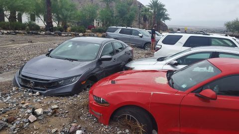 Cars are seen stuck in mud and debris at The Inn at Death Valley on August 5, 2022.