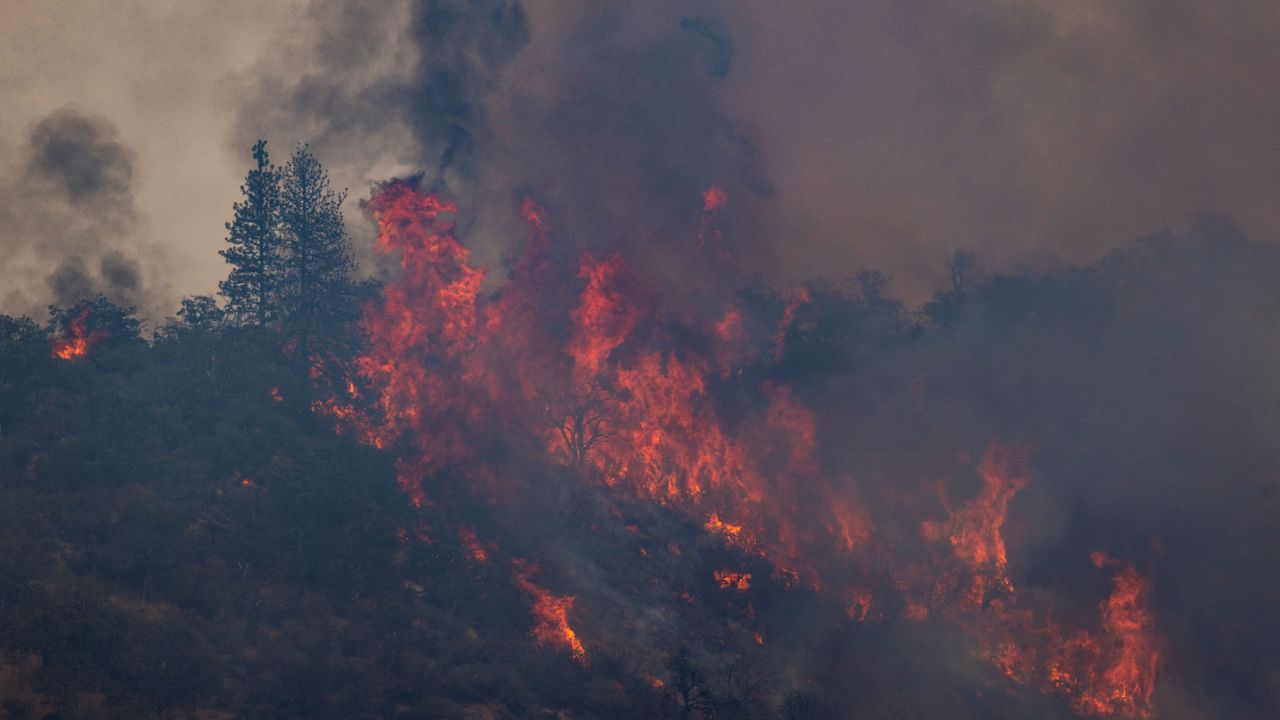 Flames make a run uphill in the McKinney Fire on August 1.