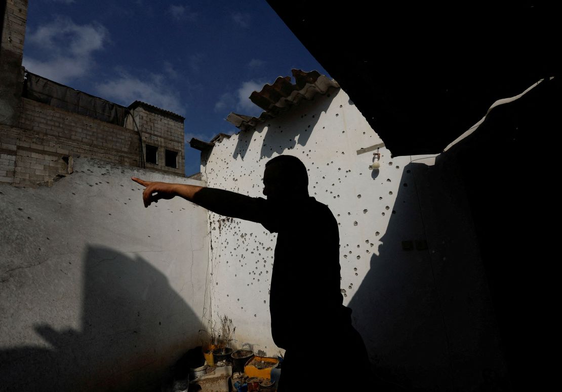 A Palestinian man inspects a damaged house in the northern Gaza Strip on Saturday.