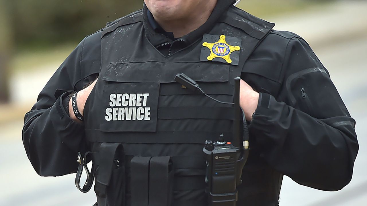 A Secret Service officer stands in front of the Darby Community Center during President Joe Biden's visit there to promote the recent stimulus bill March 16, 2021.