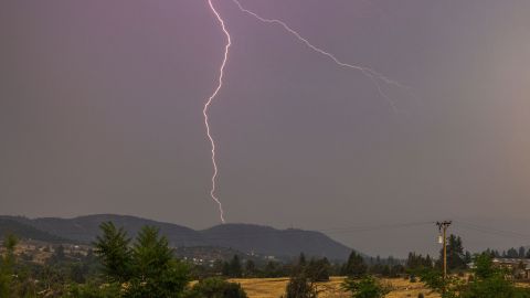 Lightning strikes east of the eastern front of the McKinney Fire in the Klamath National Forest  in California.