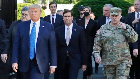 In this June 1, 2020 file photo, President Donald Trump departs the White House to visit outside St. John's Church, in Washington. Walking behind Trump from left are, Attorney General William Barr, Secretary of Defense Mark Esper and Gen. Mark Milley, chairman of the Joint Chiefs of Staff.