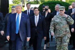 In this June 1, 2020 file photo, President Donald Trump departs the White House to visit outside St. John's Church, in Washington. Walking behind Trump from left are, Attorney General William Barr, Secretary of Defense Mark Esper and Gen. Mark Milley, chairman of the Joint Chiefs of Staff. 