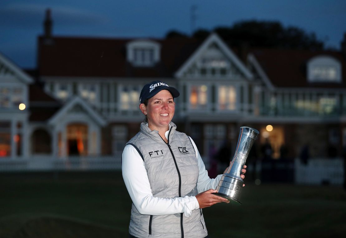 Buhai holds the trophy after her victory.