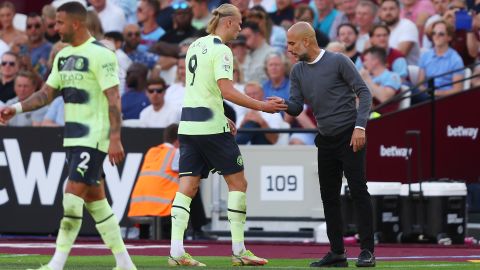 Guardiola and Haaland shake hands as the Norwegian is substituted against West Ham.