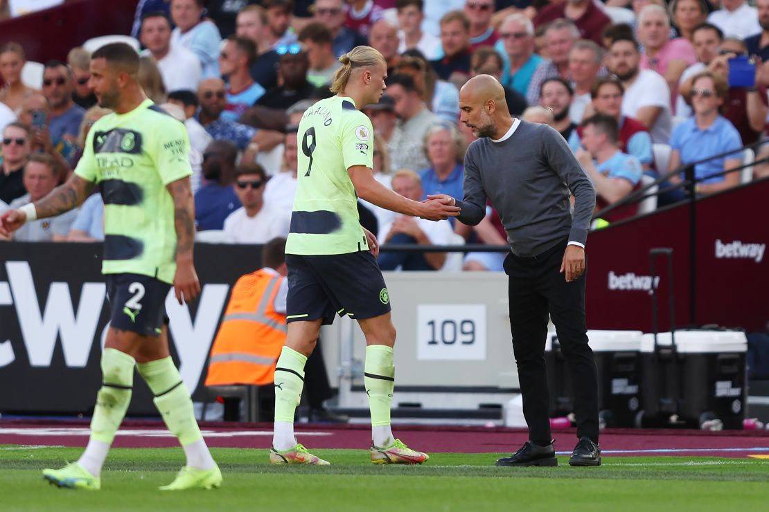 Guardiola and Haaland shake hands as the Norwegian is substituted against West Ham.