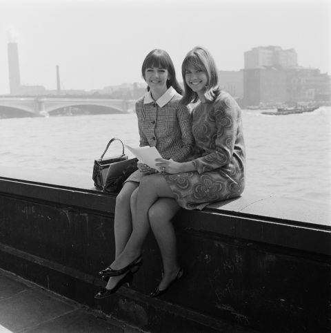 Newton-John and singing partner Pat Carroll pose for a photo in London in 1966. Newton-John recorded her first single in England in 1966 and scored a few international hits, but she remained largely unknown to US audiences until 1973, when 