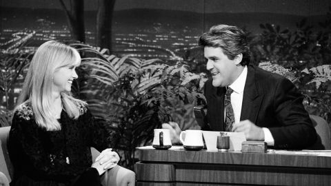 Newton-John is interviewed by Jay Leno on "The Tonight Show" in 1990.