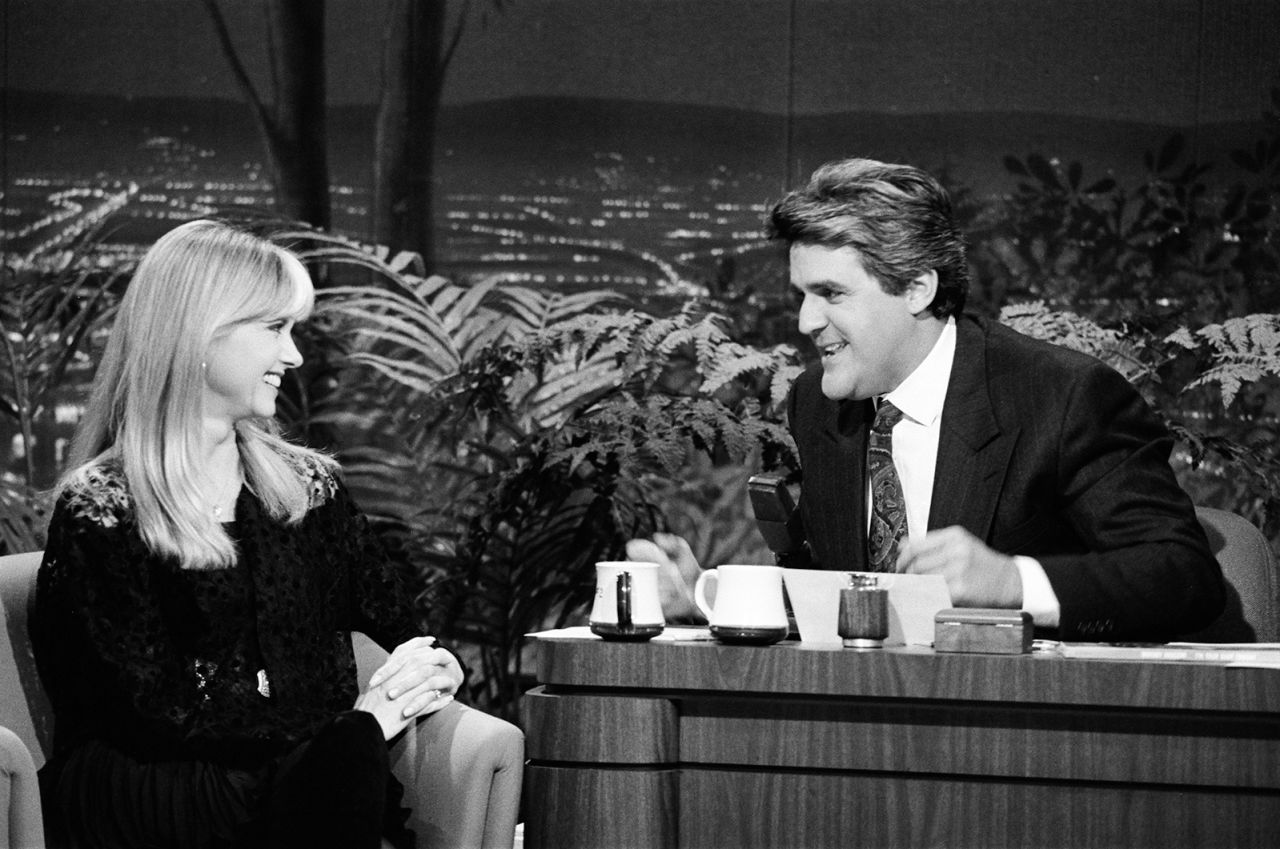 Newton-John is interviewed by Jay Leno on "The Tonight Show" in 1990.
