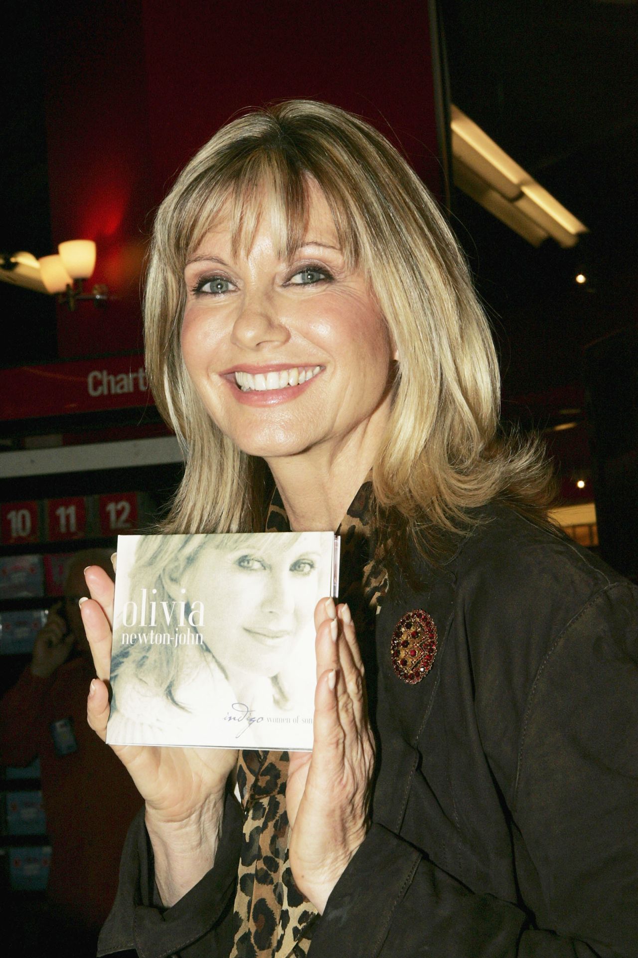 Newton-John promotes her album "Indigo: Women Of Song" at a store in Sydney in 2004.