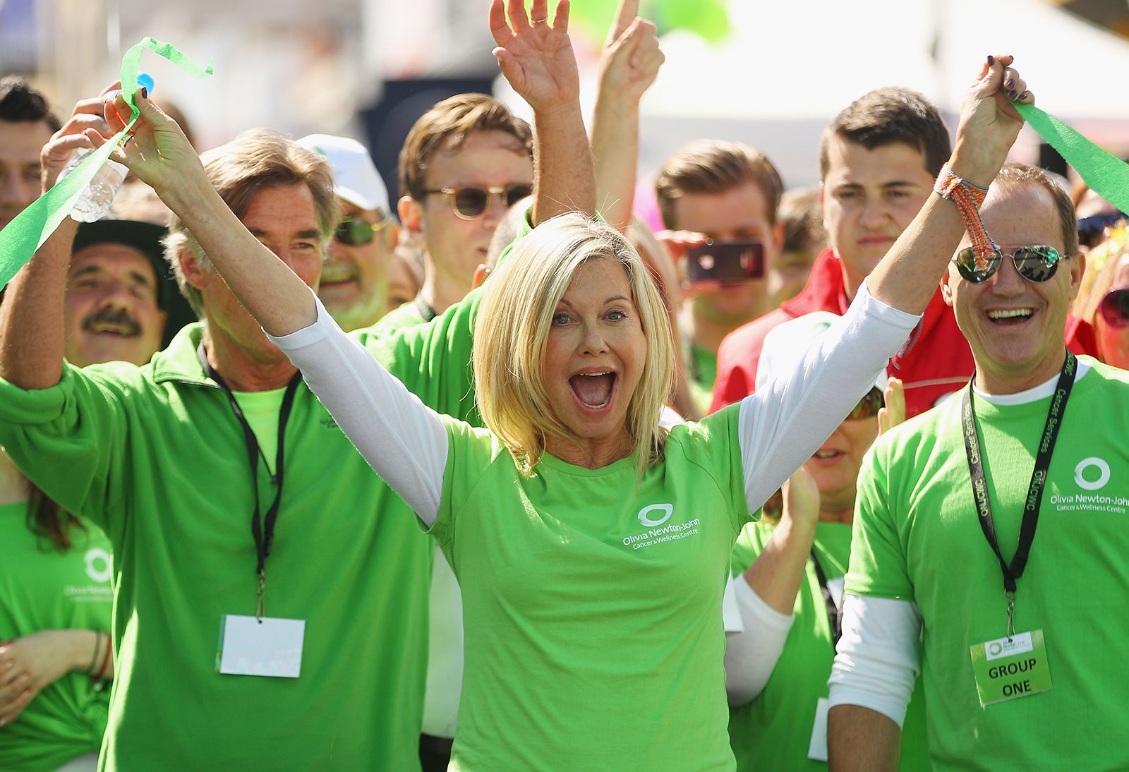 Newton-John celebrates at a charity walk.