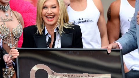 Newton-John receives a ceremonial key to the Las Vegas Strip in 2014. She was launching a residency show that month.