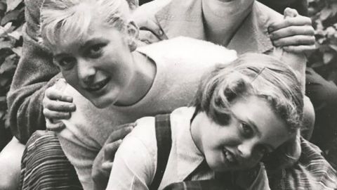 A young Newton-John is seen in front here with her father, Brin; her brother, Hugh; her mother, Irene; and her sister, Rona. Newton-John was born in Cambridge, England, in 1948. She moved with her family to Australia when she was 5.