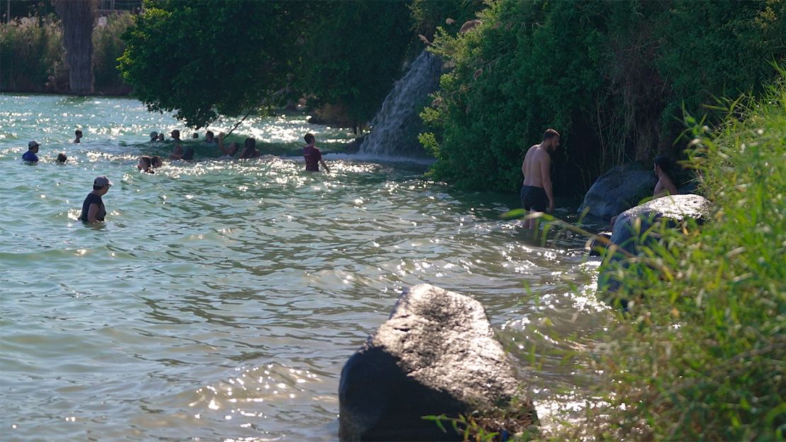 People bathing in the Sea of Galilee, which despite its name, is actually a freshwater lake.