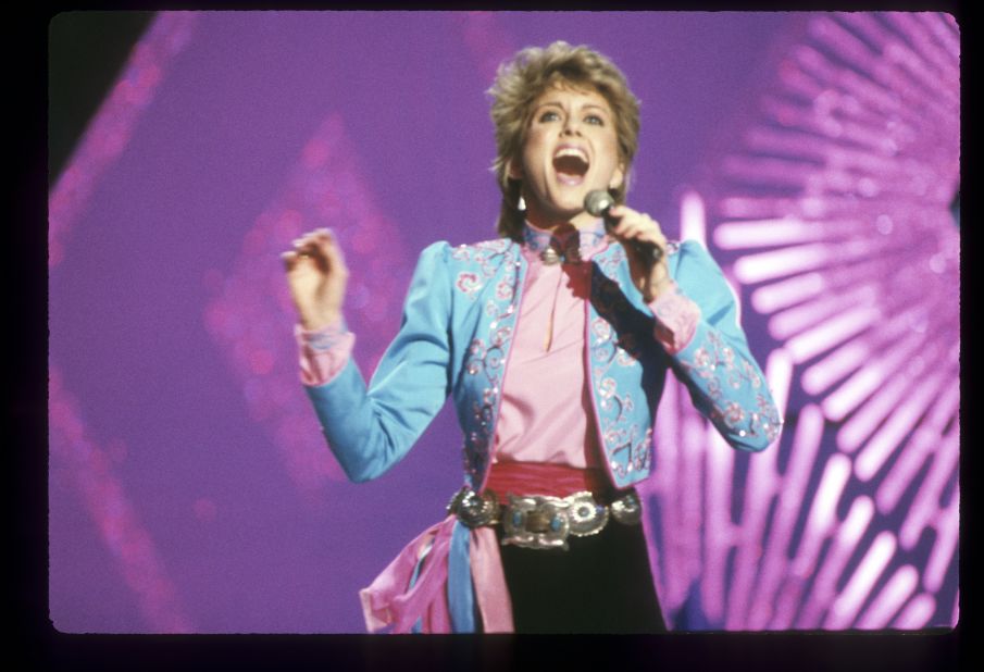 Newton-John in a Spanish matador-themed look during a performance at the 1982 American Music Awards.