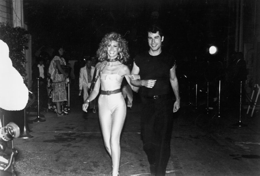 Newton-John with her "Grease" co-star John Travolta styled in looks inspired by their characters at the film's 1978 premiere. 