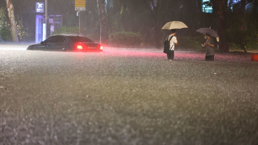 A vehicle is submerged in a flooded road in Seoul, Monday, Aug. 8, 2022. Heavy rains drenched South Korea's capital region, turning the streets of Seoul's affluent Gangnam district into a river, leaving submerged vehicles and overwhelming public transport systems. 