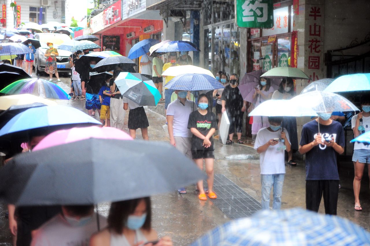 Residents queue up in heavy rain for Covid tests on August 8 in Sanya, 'China's Hawaii.'