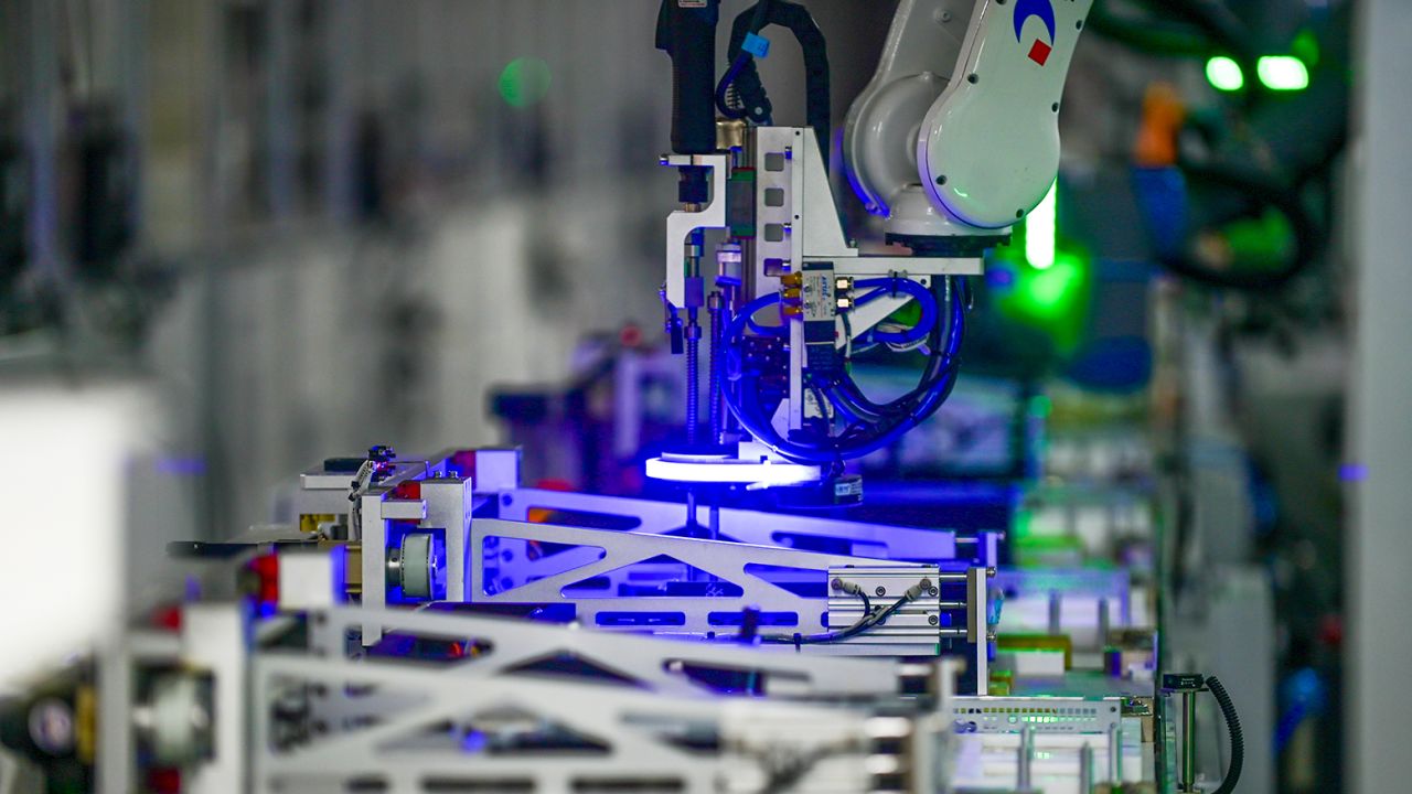 A robotic arm is seen on the assembly line of computer at a computer manufacturing enterprise set up by Tsinghua Tongfang Co., Ltd on February 22, 2022 in Jinhua, Zhejiang Province of China. 