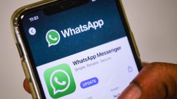 A user updates Facebook's WhatsApp application on his mobile phone in Mumbai on November 6, 2020, 